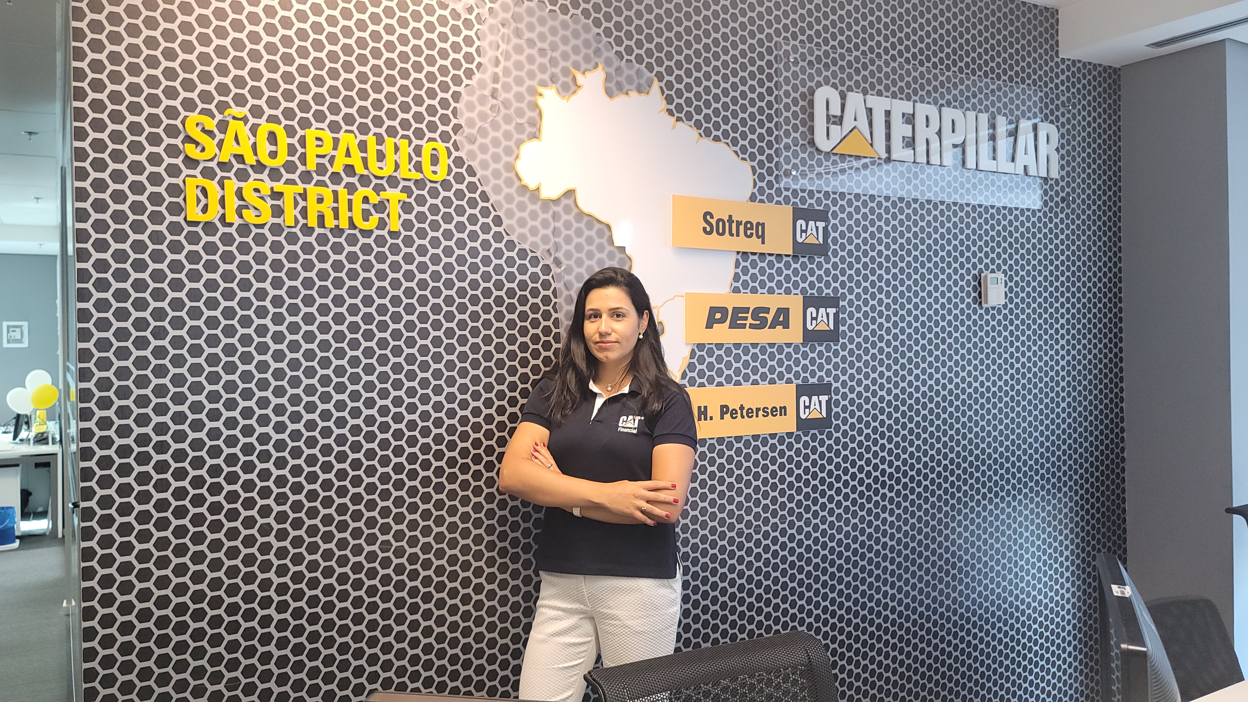 a person standing in front of a wall with a map of the state