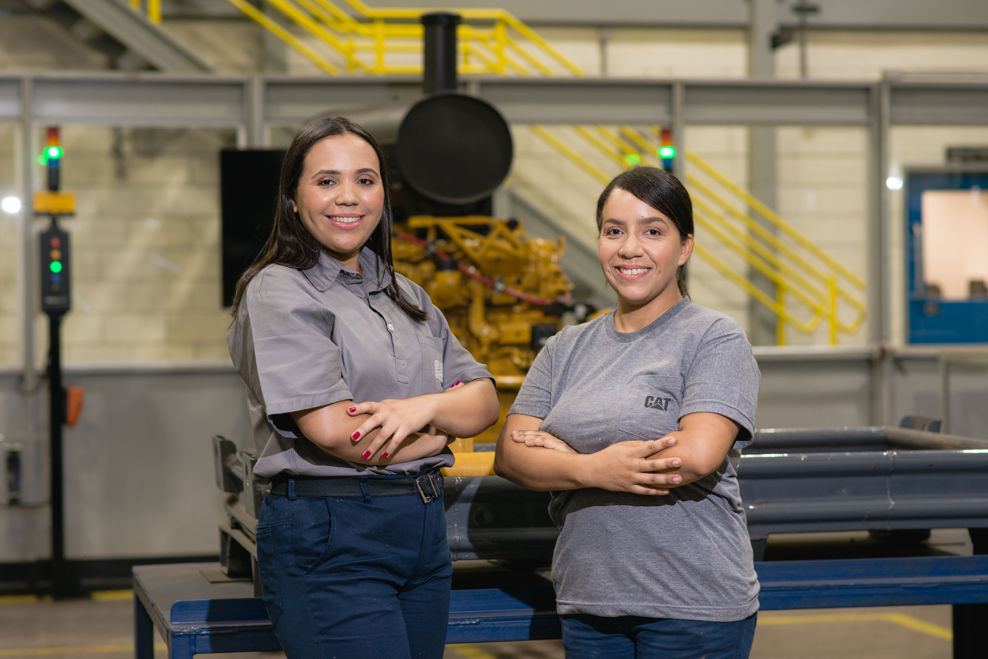 two women standing in a factory