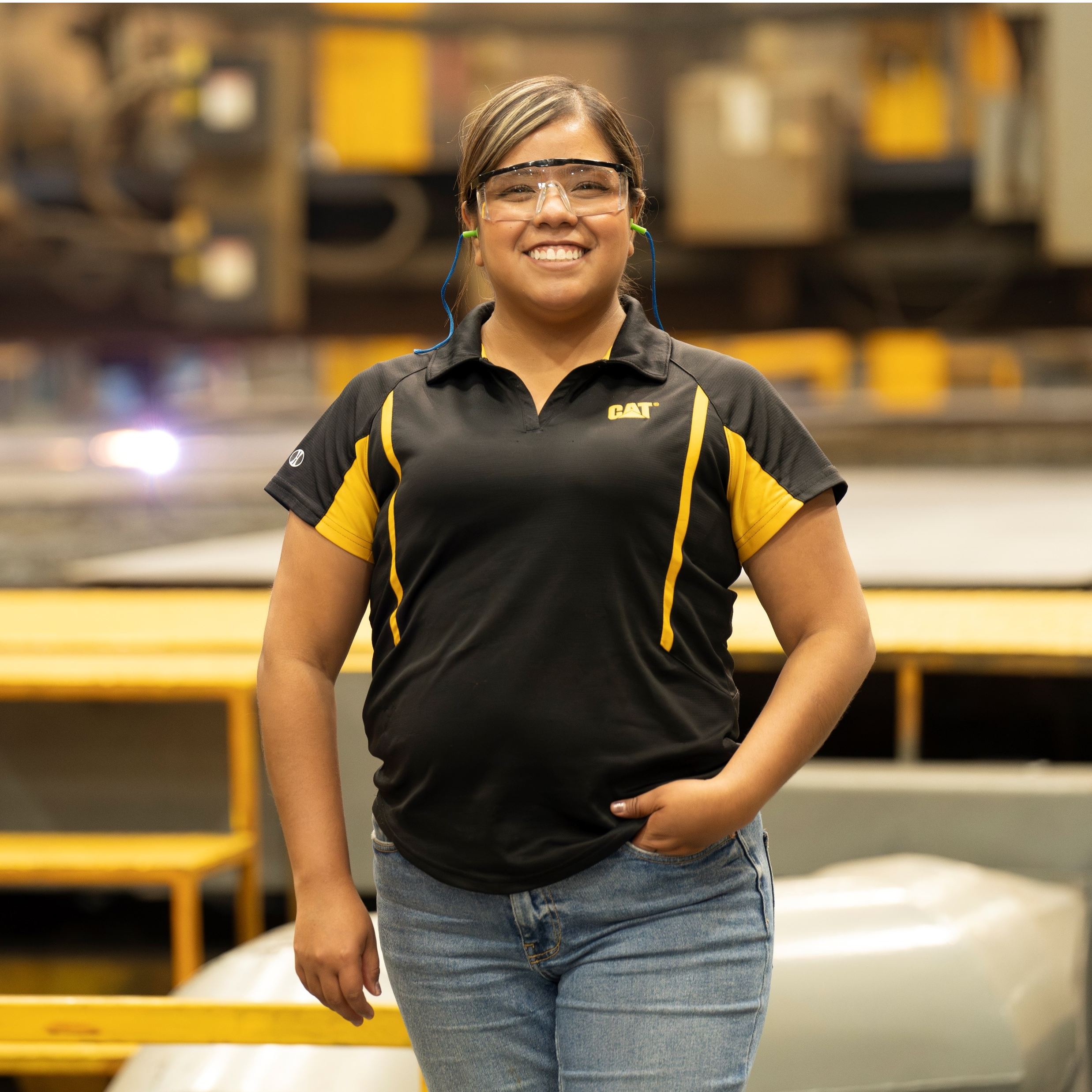 a person wearing safety glasses and a black shirt