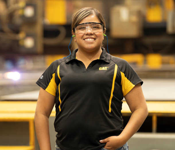 a person wearing safety glasses and a black shirt