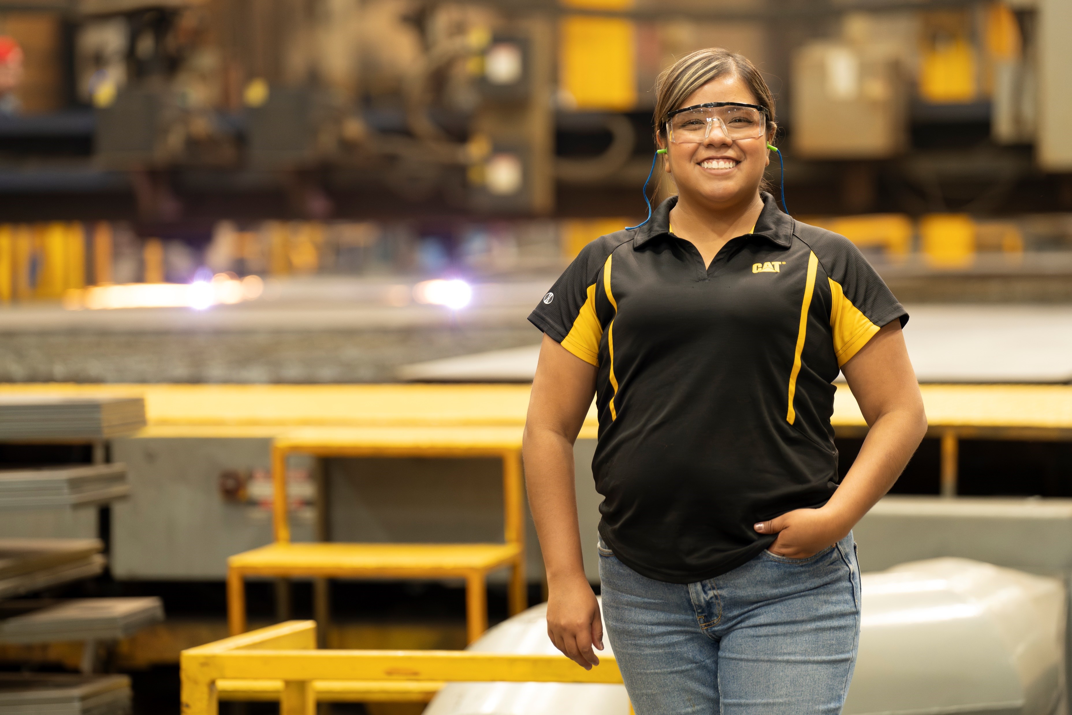 a person wearing safety glasses and a black shirt