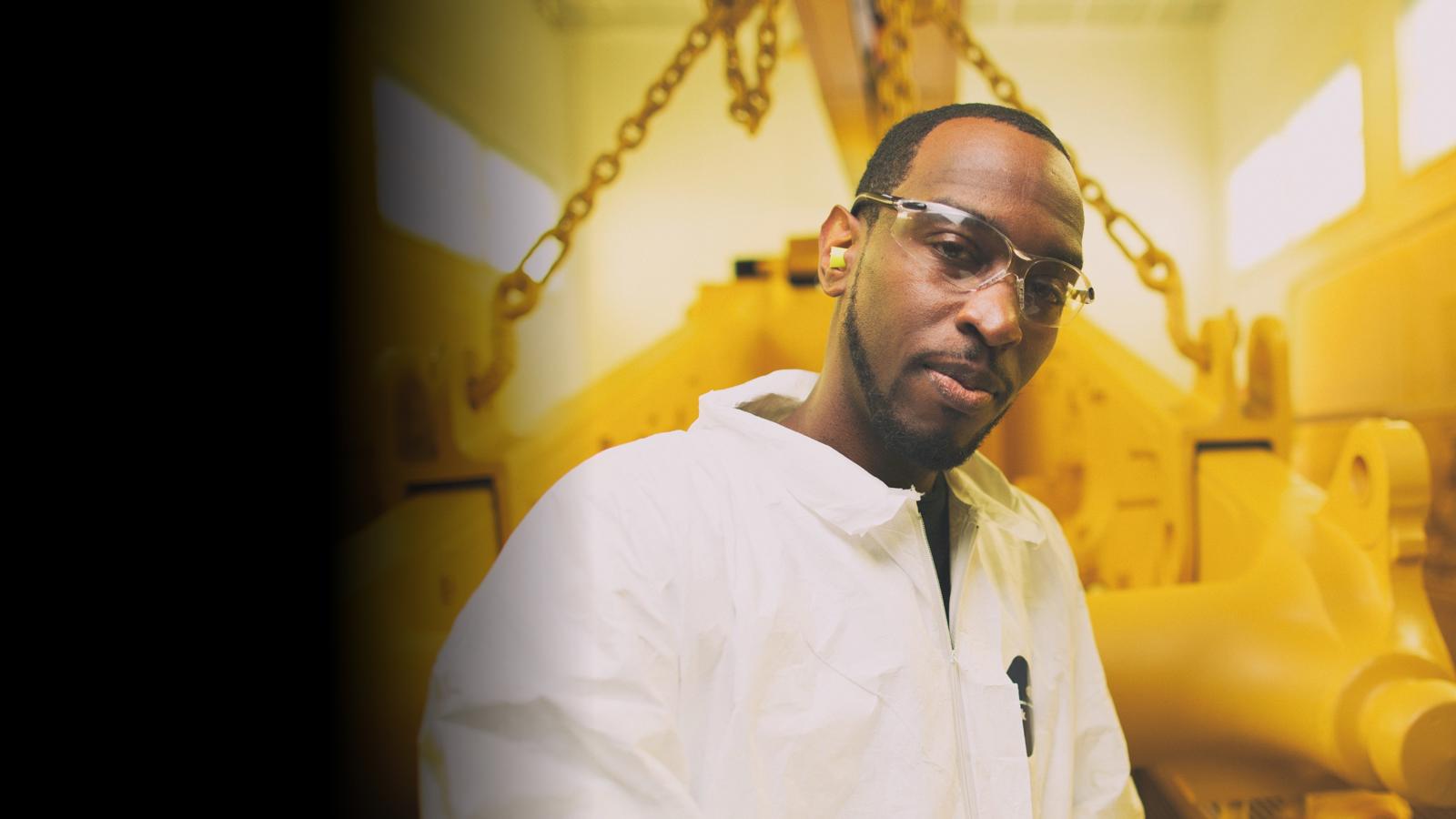 a person wearing glasses and a white shirt
