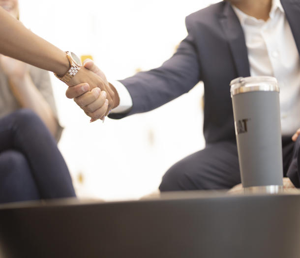 a person and person shaking hands